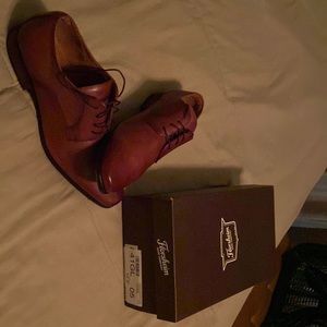 This pair of Florsheim dress shoes size 12 color brown with  box brand new
